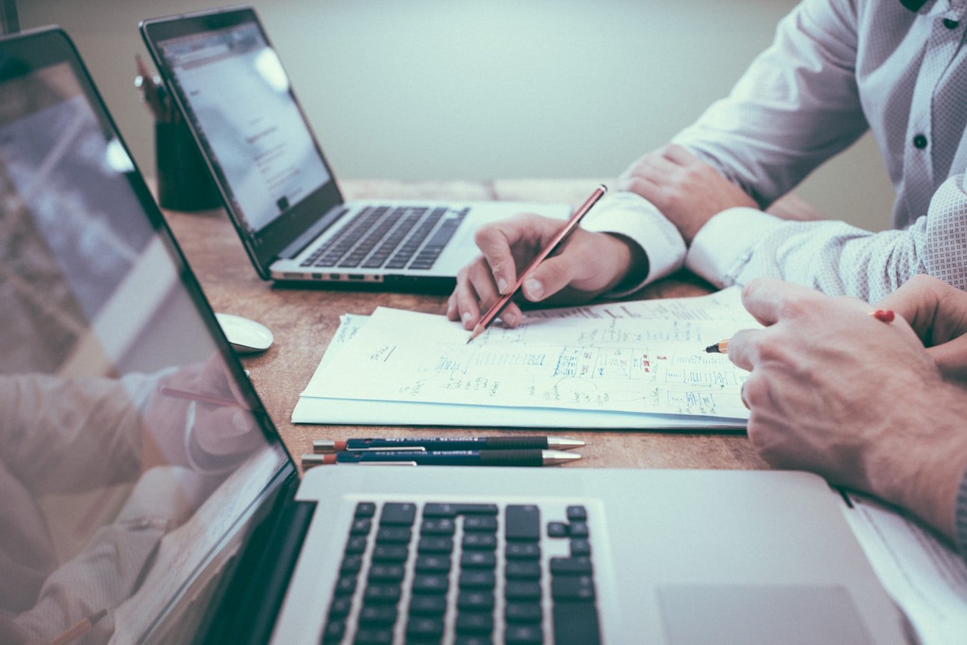 Business strategy and investment documents on a desk